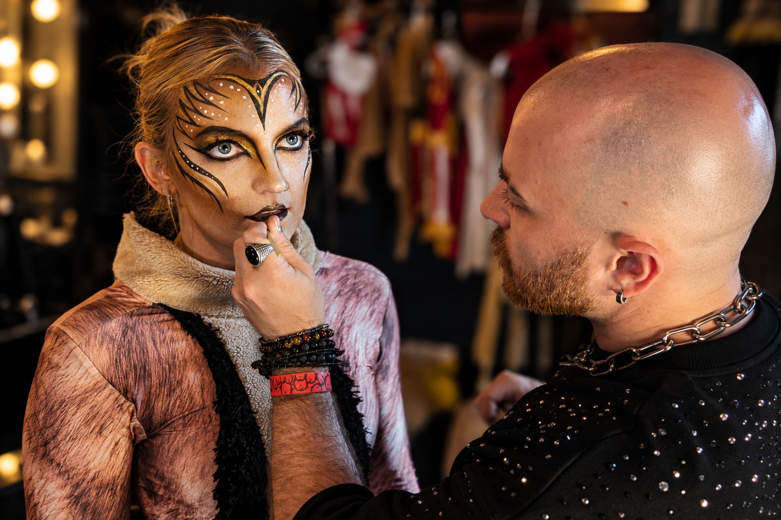 A makeup artist carrying a detailed character design through to a finished performer